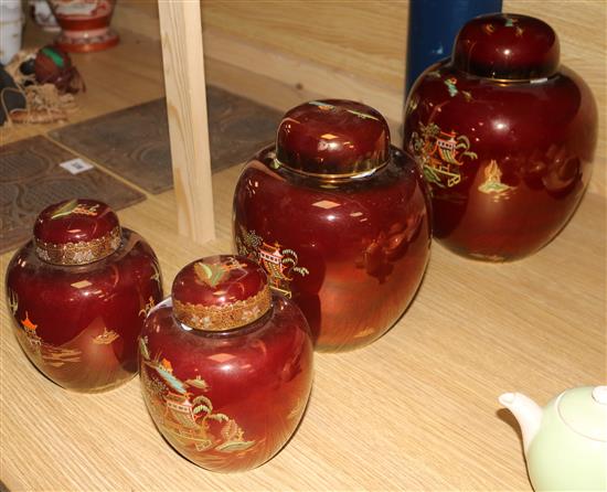 Two Carlton Ware Rouge Royale Pagoda ginger jars and covers and a smaller similar pair (one cover a.f.) H.27cm- tallest